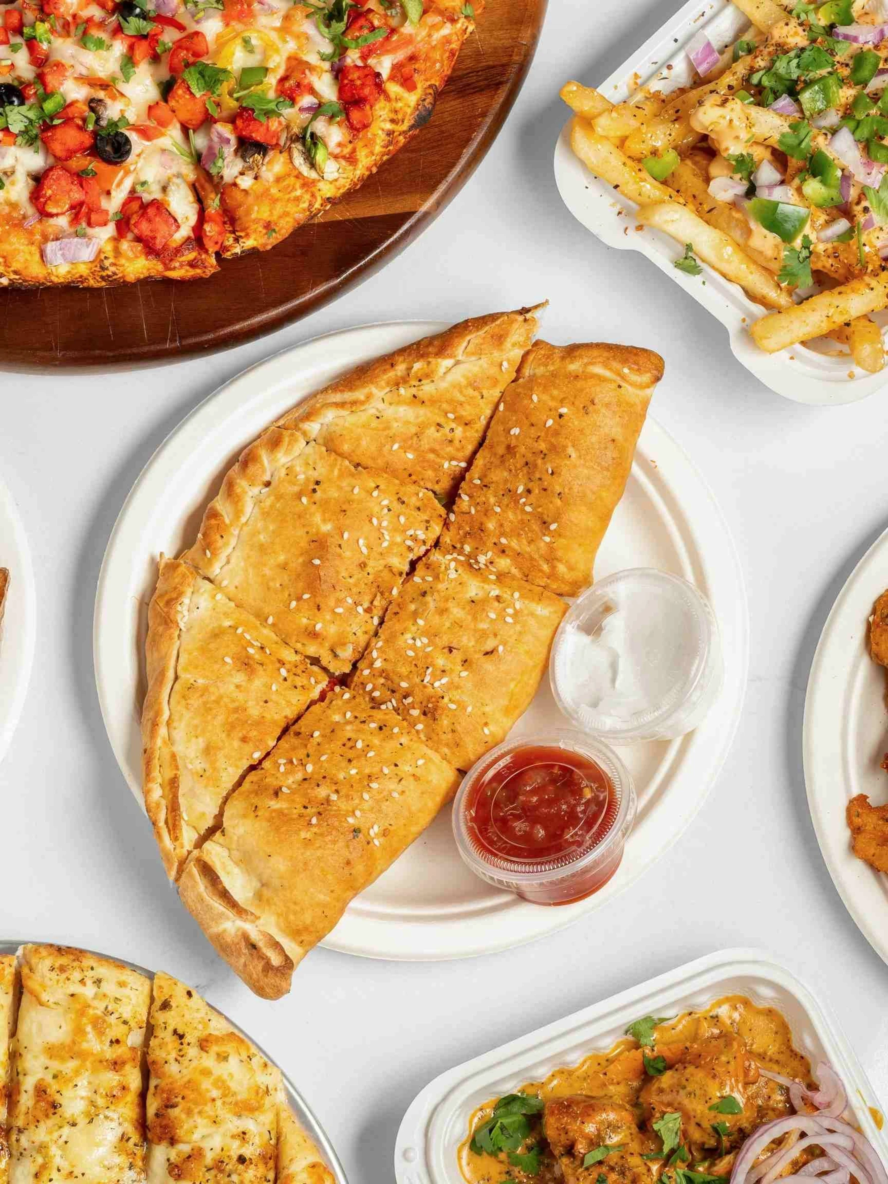 Punjabi Fusion Catering by Calzone Corner - Office Lunches and Parties in Calgary NE